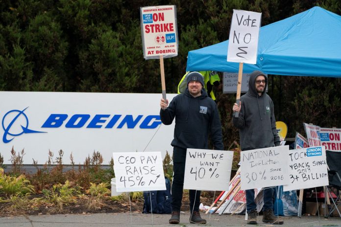Boeing union backs sweetened contract offer that could end strike, sets vote for Monday