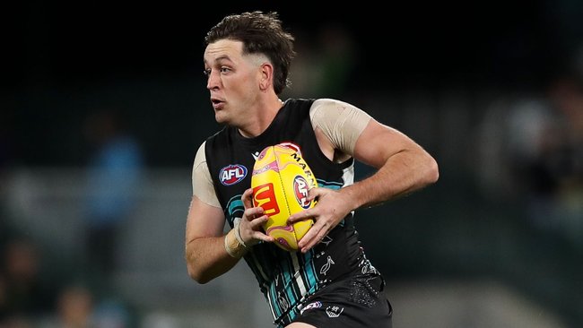 Port coach Josh Carr takes rare shot at Bulldogs counterpart Luke Beveridge over Zak Butters chase