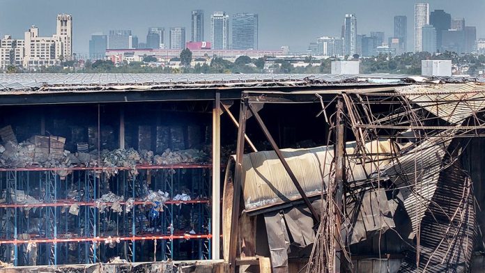 Rotting food stench still hangs over neighborhood weeks after massive warehouse blaze